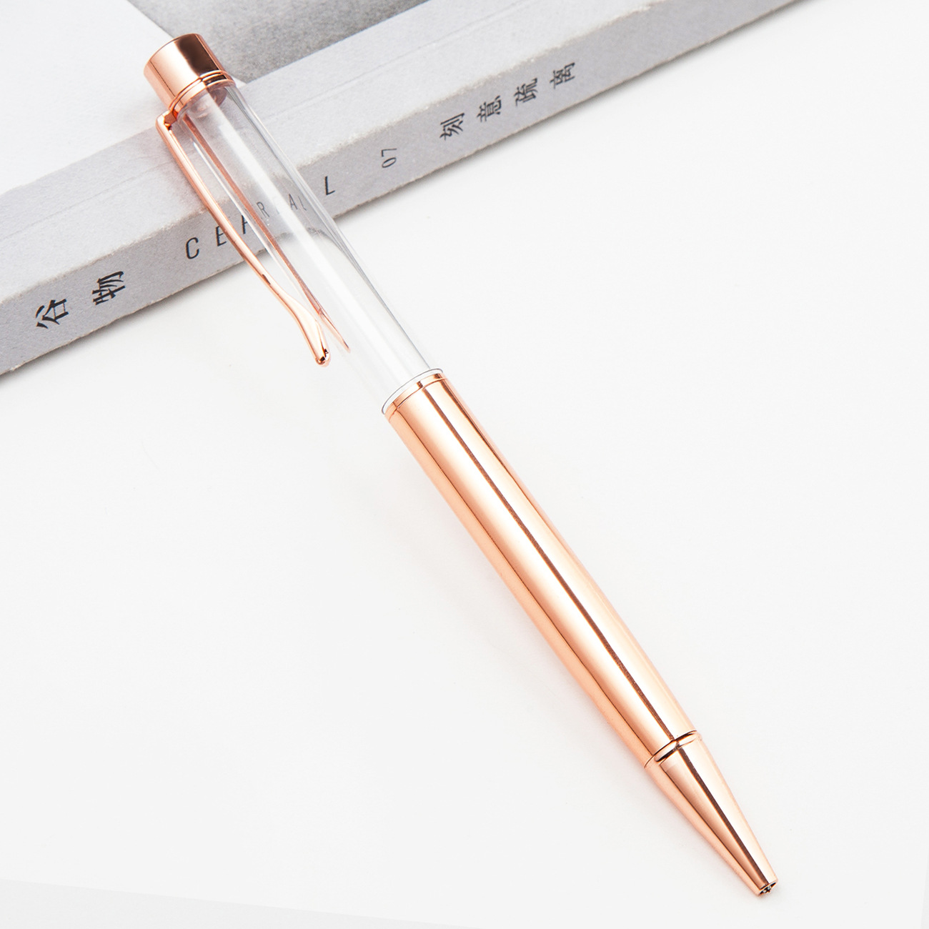 Fábrica al por mayor de metal creativo bolígrafo DIY impresión pluma de cristal japonés y coreano llenado de aceite tubo vacío bolígrafo