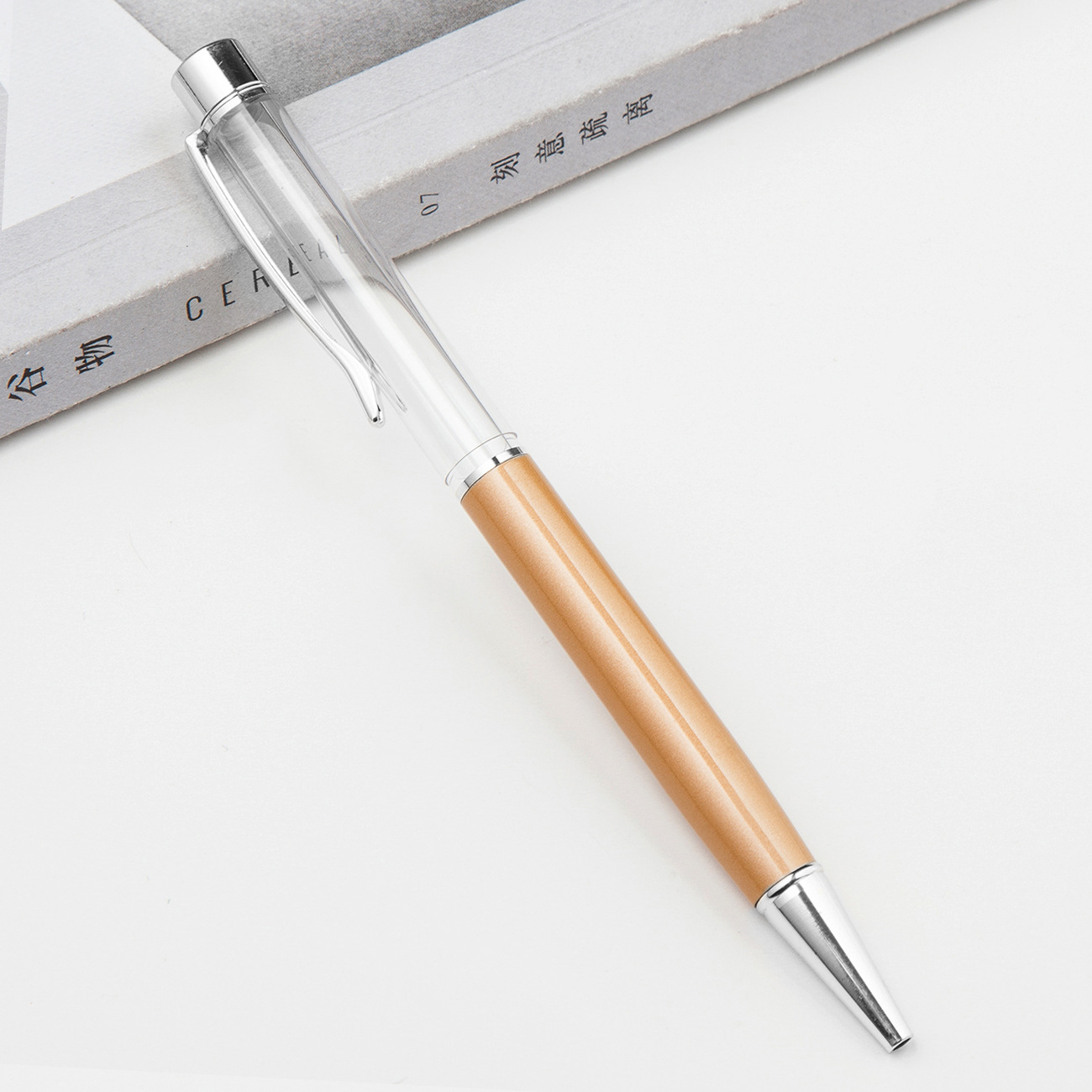 Fábrica al por mayor de metal creativo bolígrafo DIY impresión pluma de cristal japonés y coreano llenado de aceite tubo vacío bolígrafo