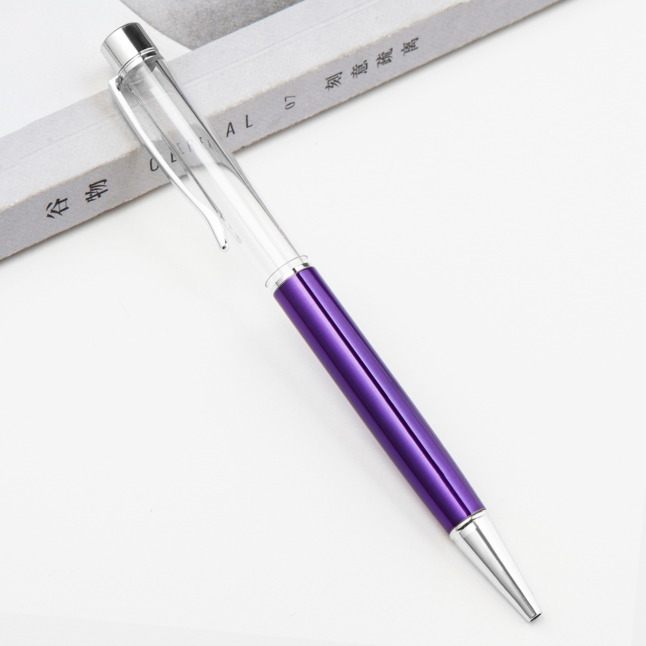 Fábrica al por mayor de metal creativo bolígrafo DIY impresión pluma de cristal japonés y coreano llenado de aceite tubo vacío bolígrafo