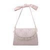 Handheld retro bag from pearl with bow