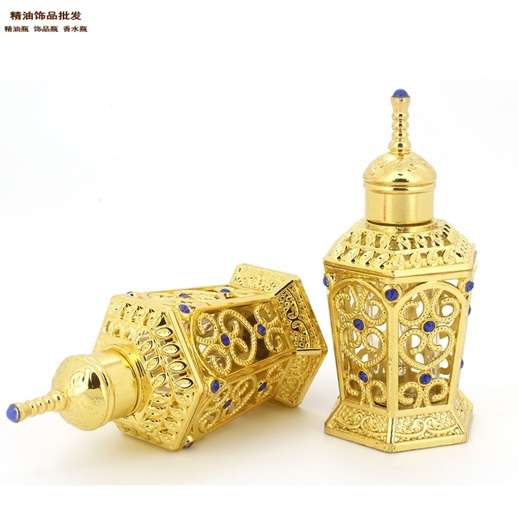 Joyería de aceite esencial neto en stock al por mayor 10ML hexágono dorado Oriente Medio botella de perfume botella de aceite esencial sub-embalaje botella vacía adornos