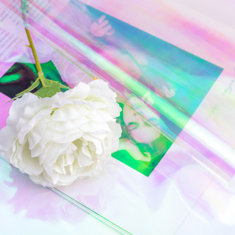 Flor de IRIS de colores papel de embalaje al por mayor impermeable película de color mágico película láser color transparente flor tienda ramo material de embalaje
