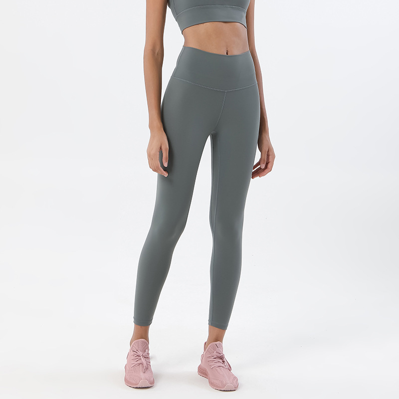Procesamiento personalizado de dos lados abrasivo desnudo sensación de pantalonada de cintura alta europea y americana para elevar las caderas de miel pescado pantalon deportivo