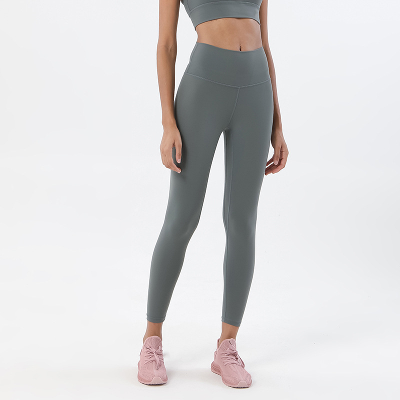 Procesamiento personalizado de dos lados abrasivo desnudo sensación de pantalonada de cintura alta europea y americana para elevar las caderas de miel pescado pantalon deportivo