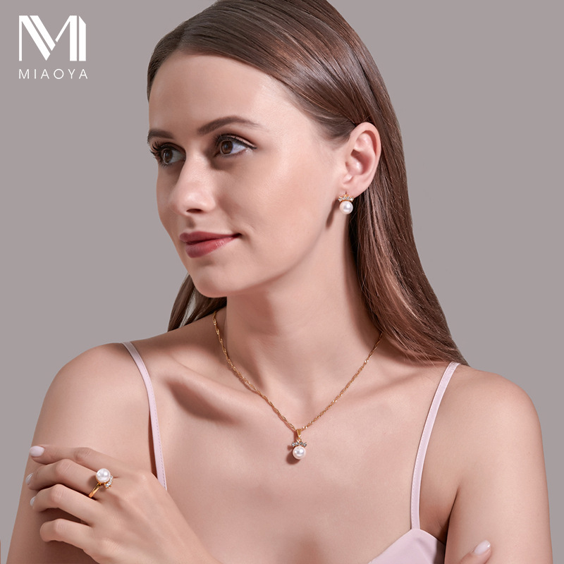 Transfronteriza nuevo traje de perlas temperamento pendientes anillo collar conjunto de tres piezas banquete de boda ropa joyería al por mayor