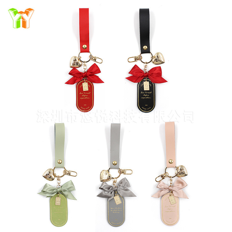multicoloured brand keychain with bow