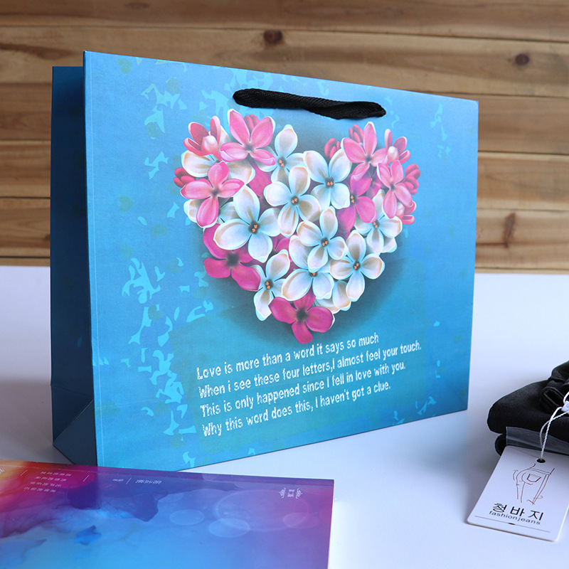 服装店衣服袋子现货可印文字logo时尚花簇服装购物纸袋蓝色手提袋