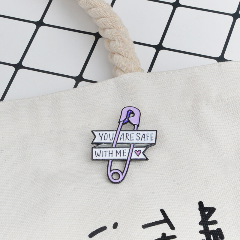 Cartoon brand pin with letters