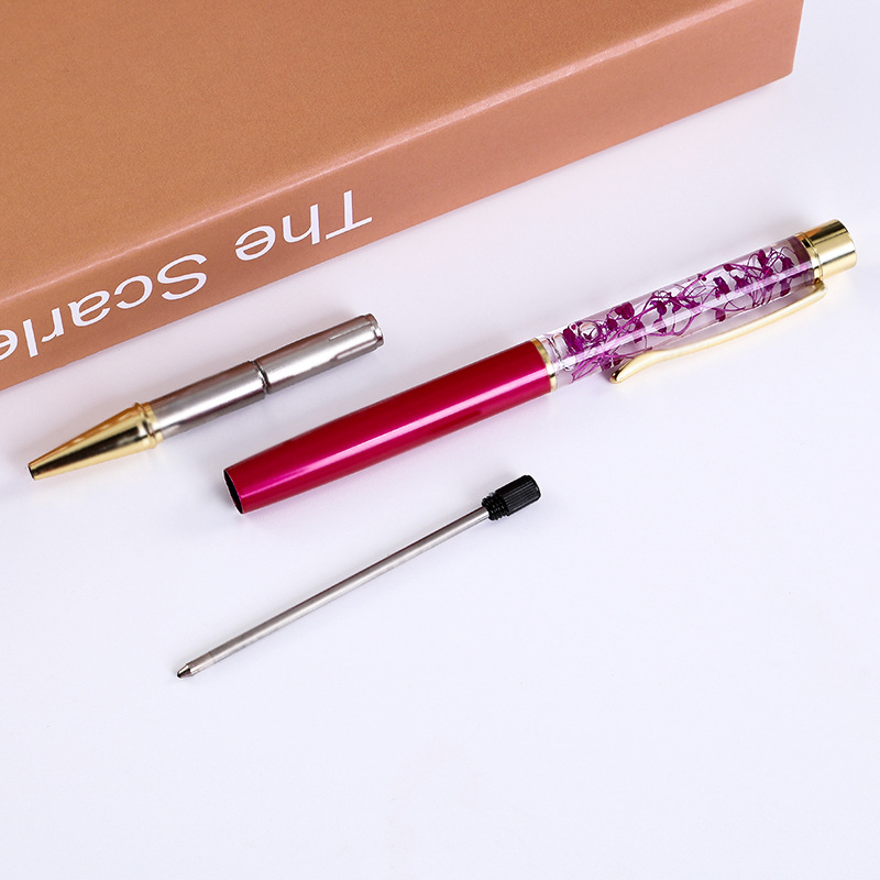 Suministro directo de fábrica flor seca bolígrafo pluma de aceite creativo DIY Bolígrafo De Metal logotipo personalizado pluma de aceite de flor seca