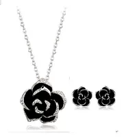 Каменная инlay? каменная инlay in Russian is каменная инlay? We should translate properly: "Stone inlay, black mountain tea, necklace and earrings, set"
