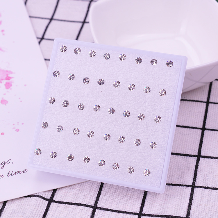 Pendientes de oreja pendientes femeninos traje puesto joyería oído hueso uñas al por mayor resina plástica redonda combinación anti-alergia