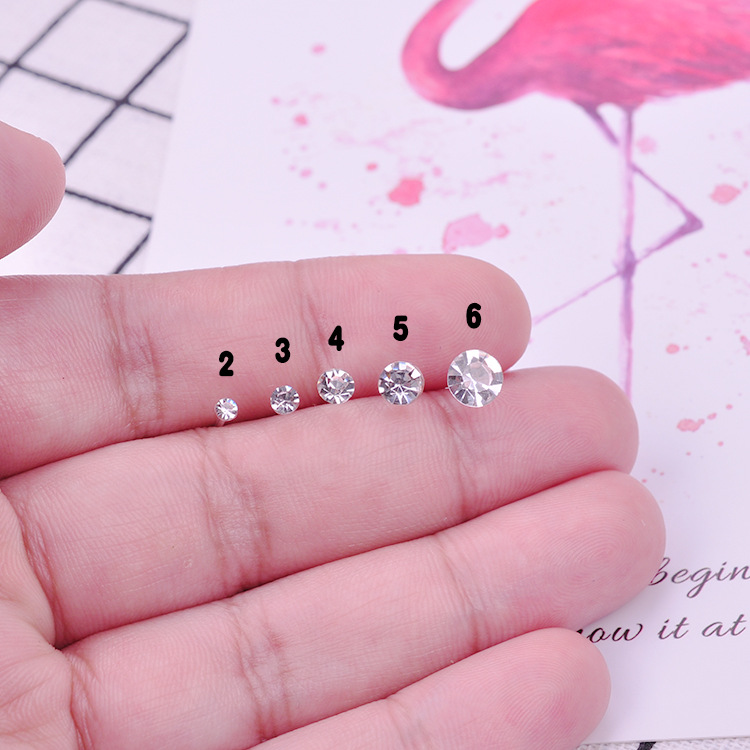 Pendientes de oreja pendientes femeninos traje puesto joyería oído hueso uñas al por mayor resina plástica redonda combinación anti-alergia