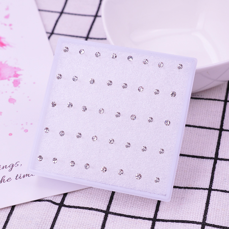 Pendientes de oreja pendientes femeninos traje puesto joyería oído hueso uñas al por mayor resina plástica redonda combinación anti-alergia