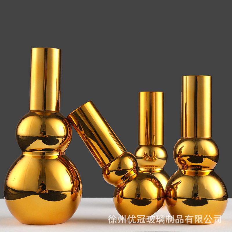 En stock suministro de galvanoplastia oro doble botella de aceite esencial de la botella vacía squeeze Spray Loción de vidrio cosmético sub-botella