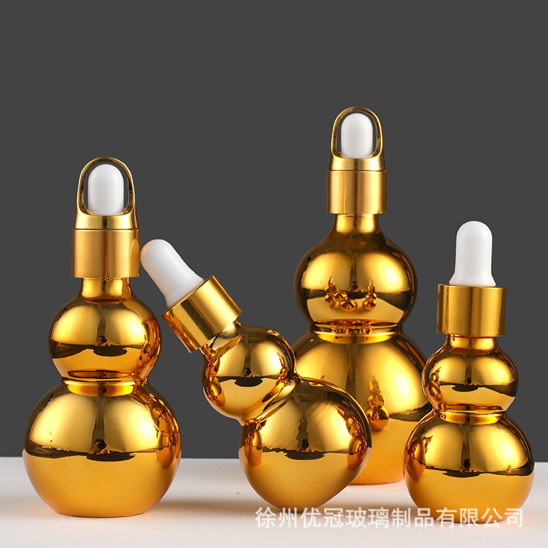 En stock suministro de galvanoplastia oro doble botella de aceite esencial de la botella vacía squeeze Spray Loción de vidrio cosmético sub-botella