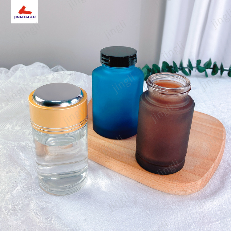 批发生产精美蒙砂厚壁玻璃保健品瓶，药品瓶，喷色