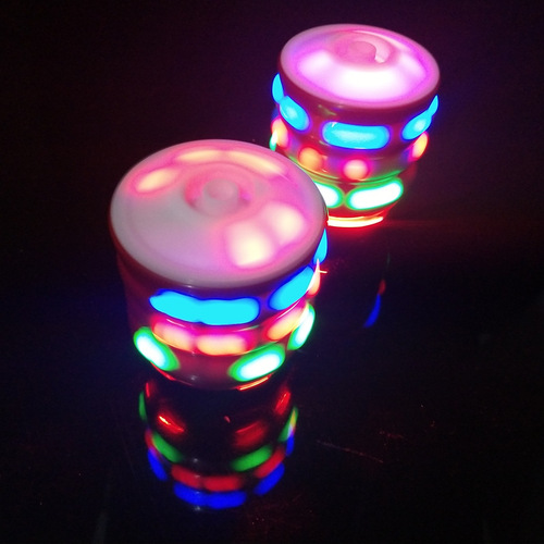 Internet celebrity music light-up imitation wood top stall selling the same toy colorful flash catapult top