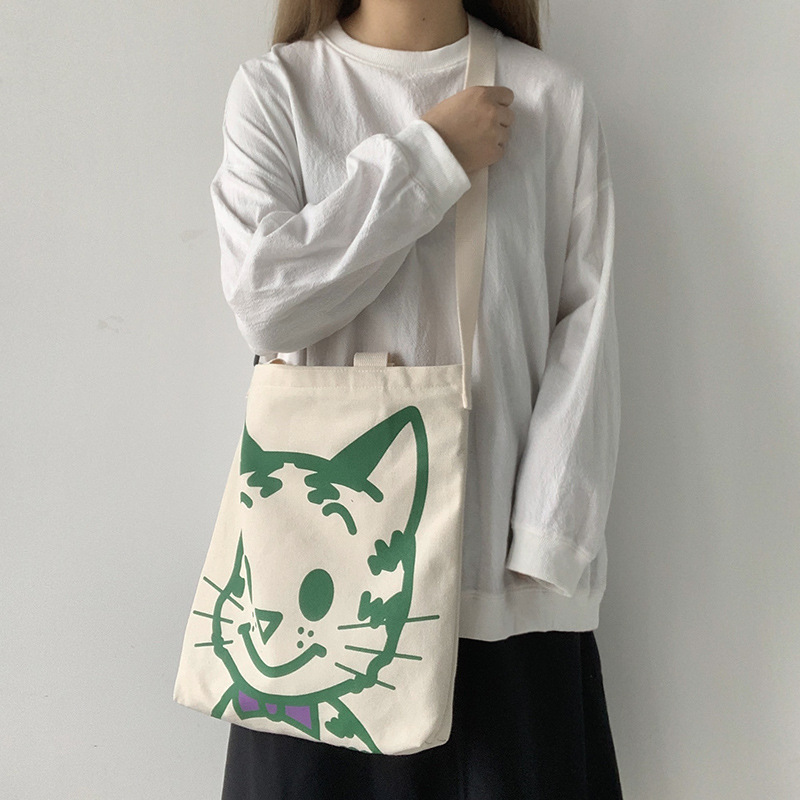 Bolso de lona bolso cruzado para mujer 2025 nuevo estilo estilo japonés versátil bolso de hombro de dibujos animados de gran capacidad bolso de tela para estudiantes estilo k