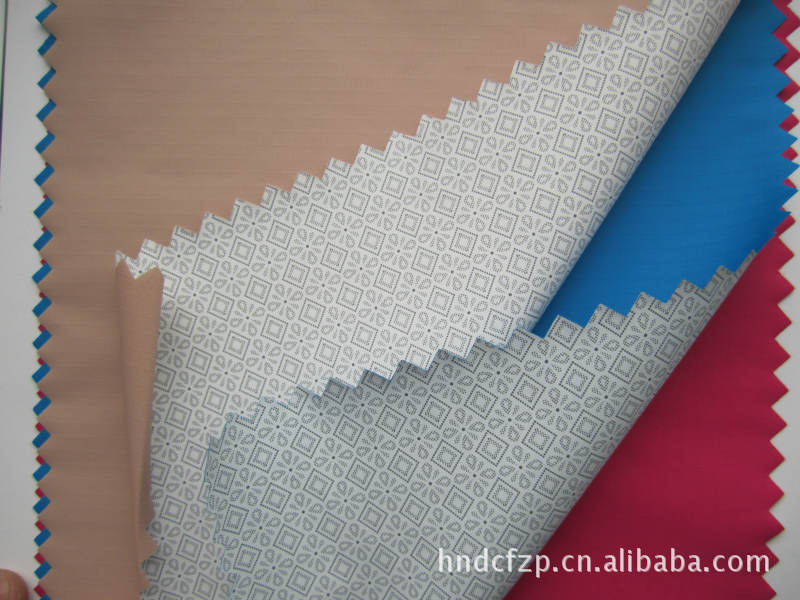 供应春亚纺塔丝绒牛津布透气透湿防水离型纸转移PU膜面料