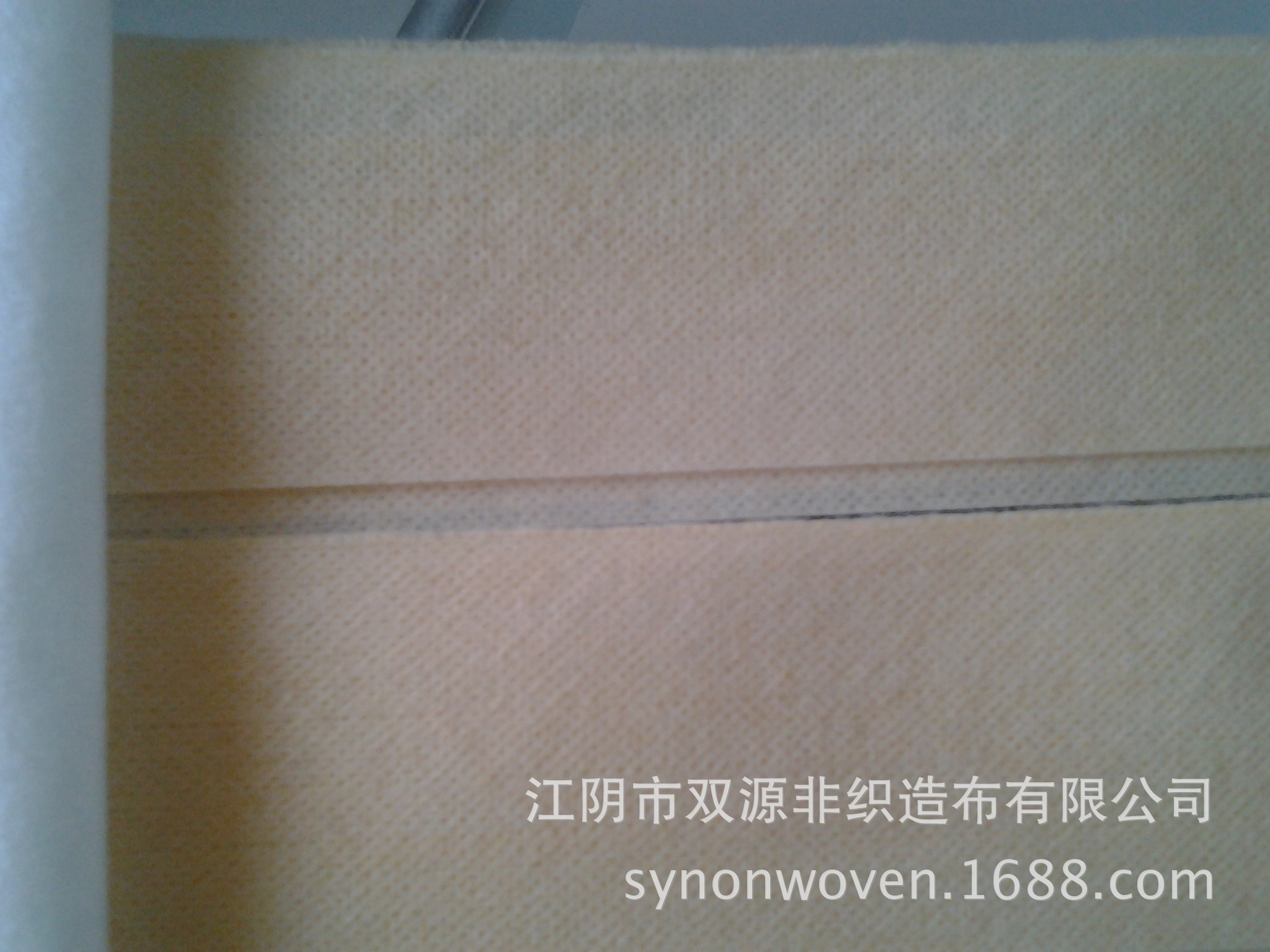 15年供应 桔色橙色黄色肤色无纺布 平纹网孔水刺无纺布