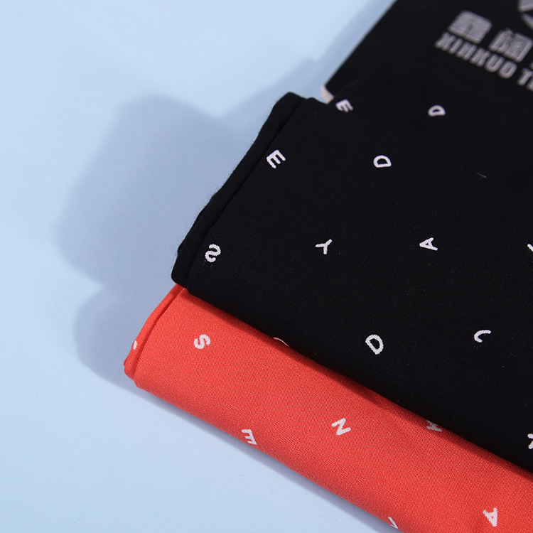 雕印人棉印花面料 110g小字母拔染印花人造棉布 印花布料