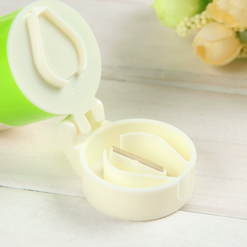 Four‑function pillbox — tablet cutter, grinder and storage, 6.3×3.7 cm, white+green or white+blue