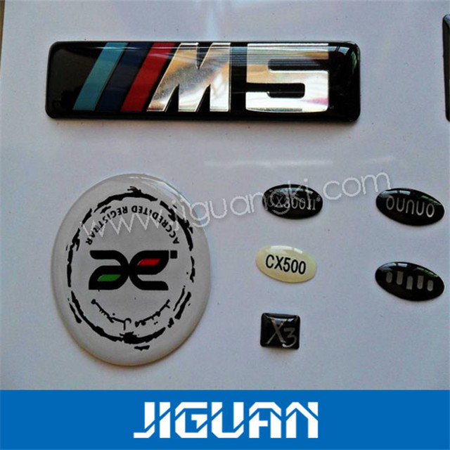 东莞水晶滴胶贴纸,彩色贴纸滴胶、车标滴胶加工、胸章水晶滴胶