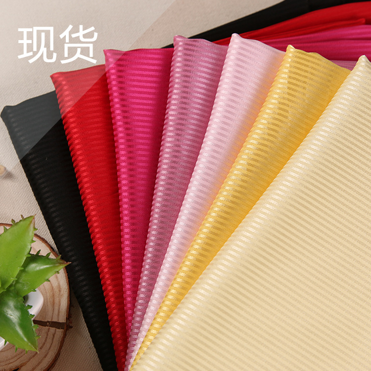 厂家供应涤氨提花细条子仿真丝色丁布 衬衫里布面料批发