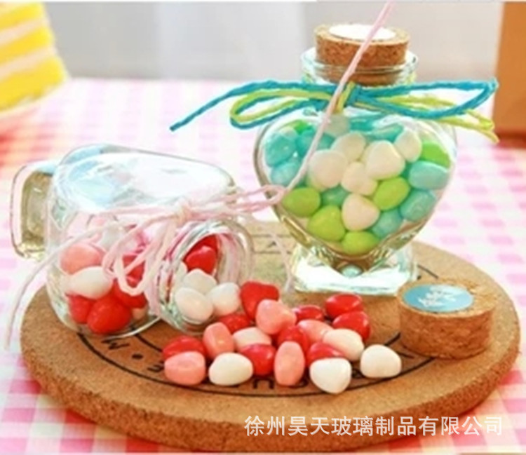 Los fabricantes suministran Linda botella de caramelo en forma de corazón botella de vidrio de corcho botella de Caramelo Suave