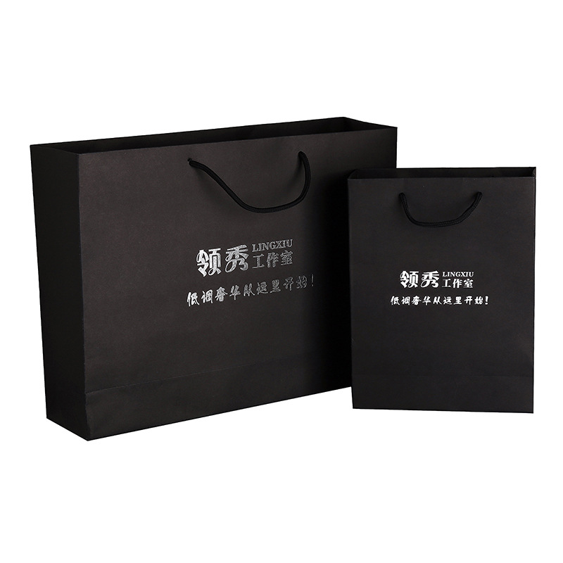 创意服装手提纸袋广告服装购物袋 白卡黑卡纸袋定做 礼品袋印Logo
