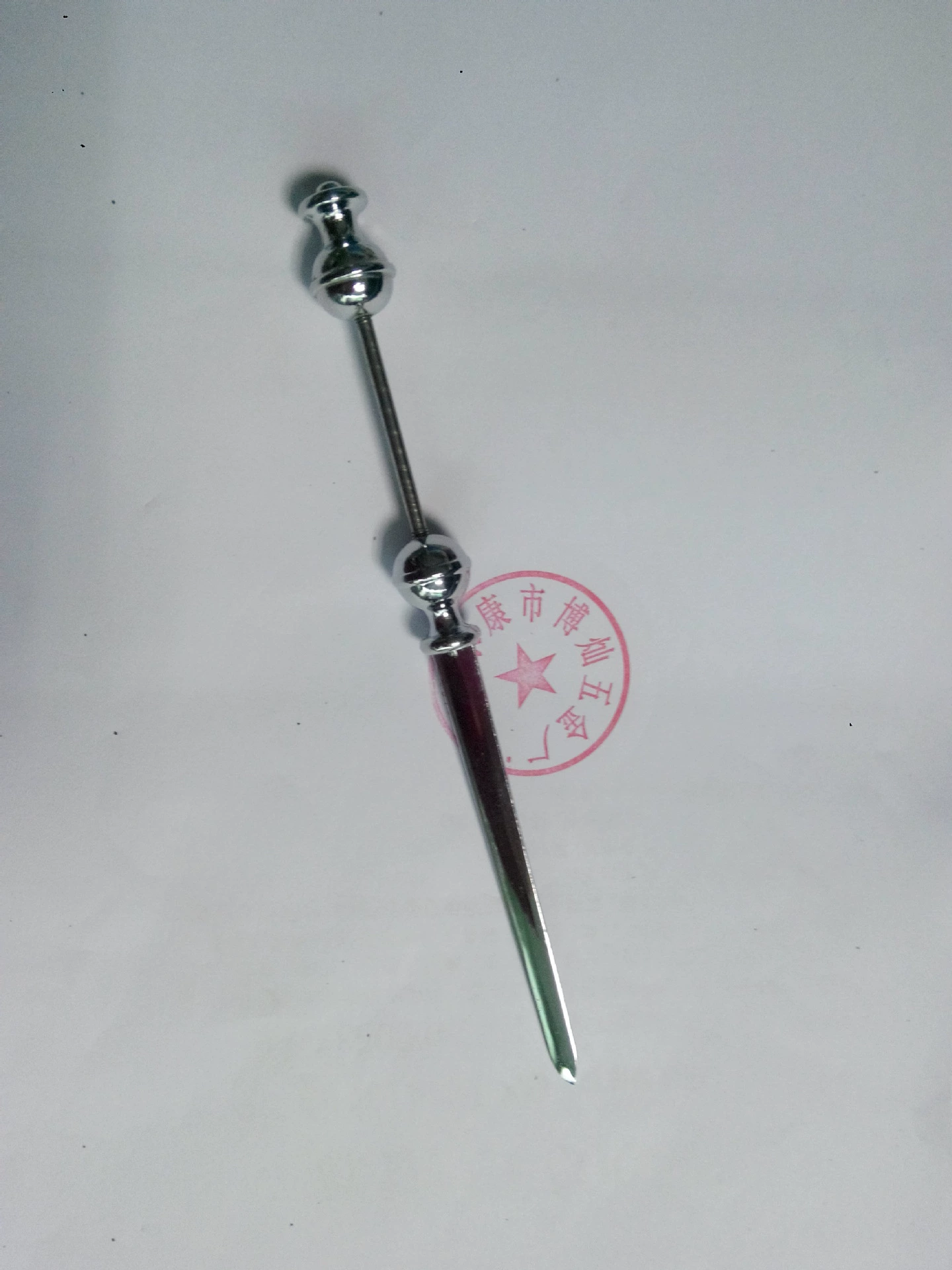 Metal opening a knife with beads