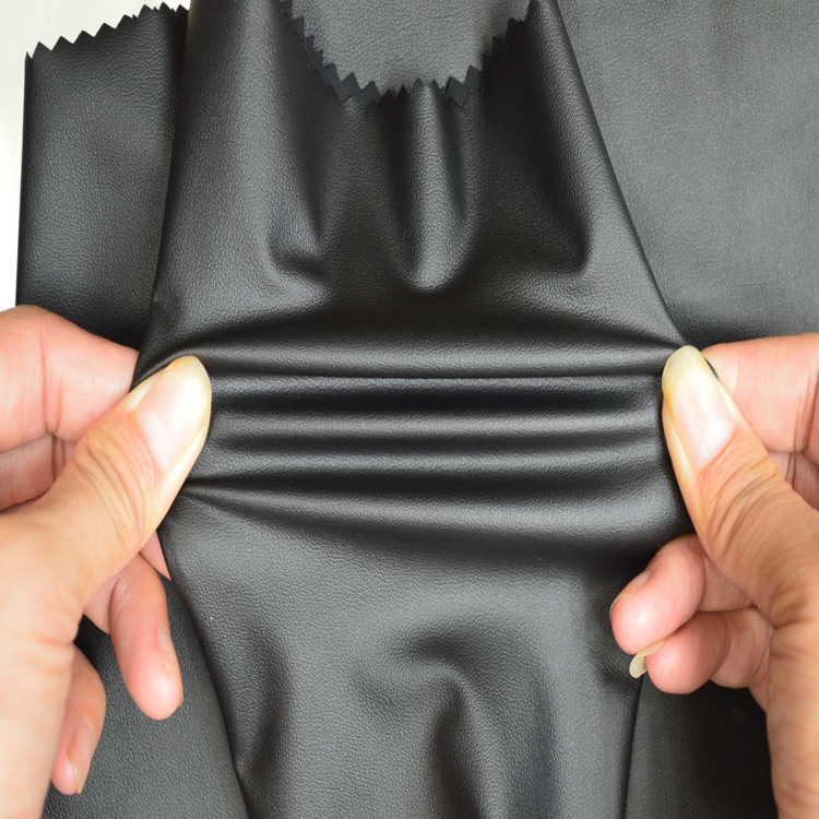 厂家供应仿PU皮革弹力针织布料可复合牛奶丝春秋打底裤料服装面料