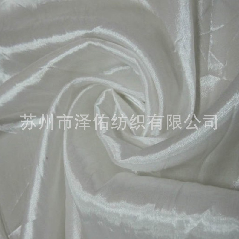 厂家直销无胆防绒布310T轧光防绒布羽绒服压光内胆布里布