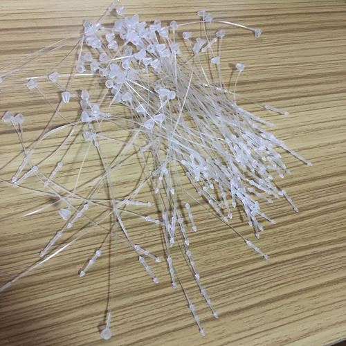 A pack of about 1,000 accessories, hand-threaded, white, strapping rope, pointed plastic packaging, snap-on buckle tie, 9CM