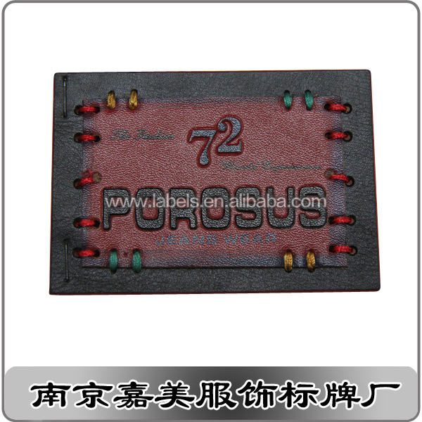 【供应】皮革压花标牌 真皮商标 牛仔裤标牌 来样定做厂家