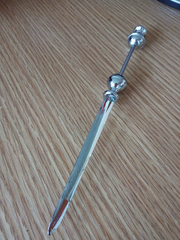 Metal opening a knife with beads