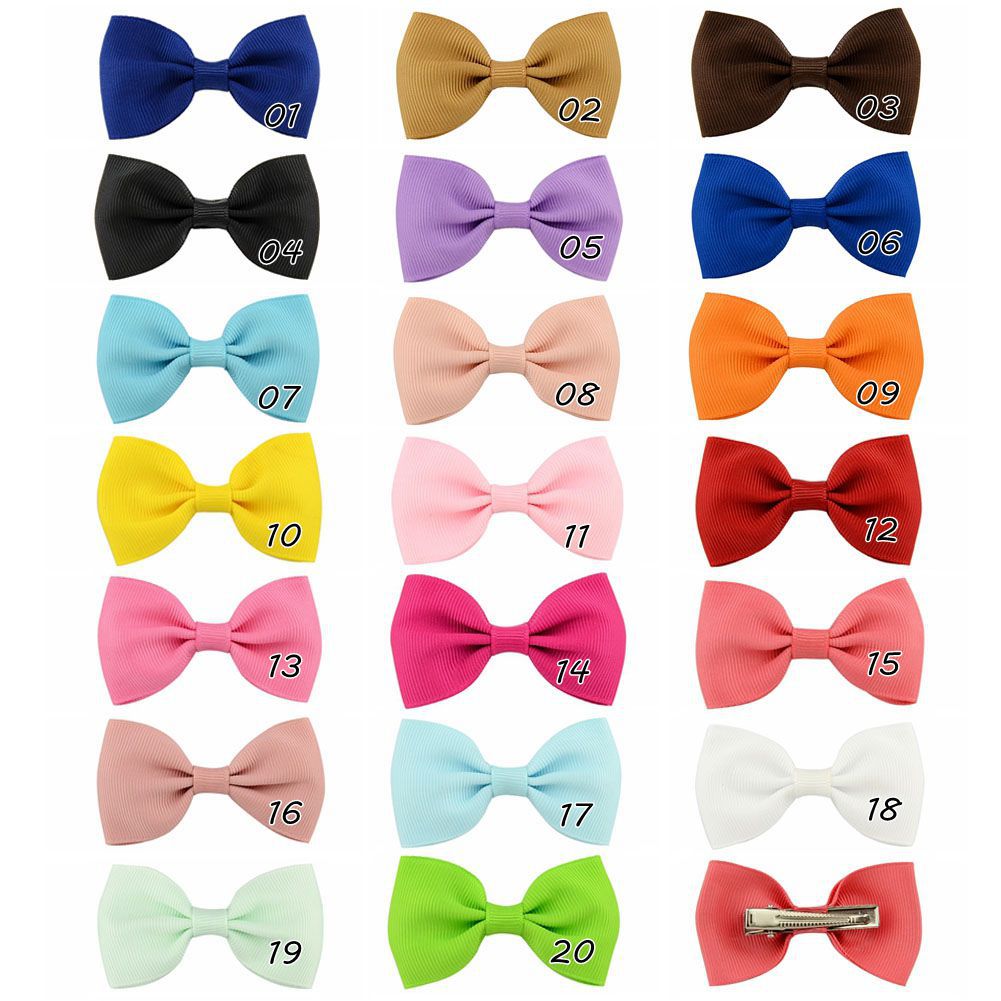 European And American Solid Color Children's Bow Cute Hairpin display picture 1