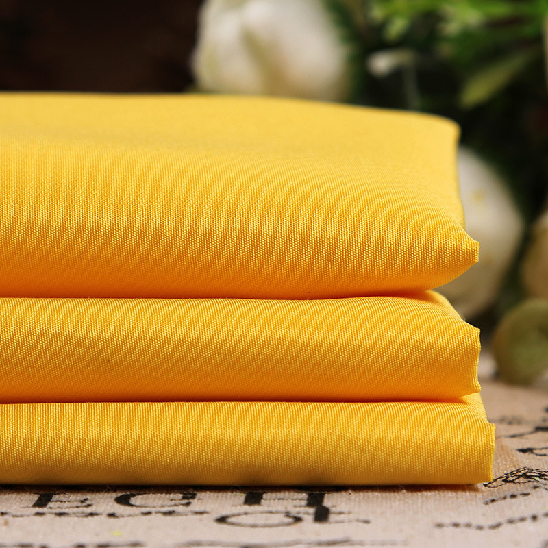 厂家现货供应 斜纹磨毛桃皮绒 210T黄色桃皮绒时尚服装里布面料