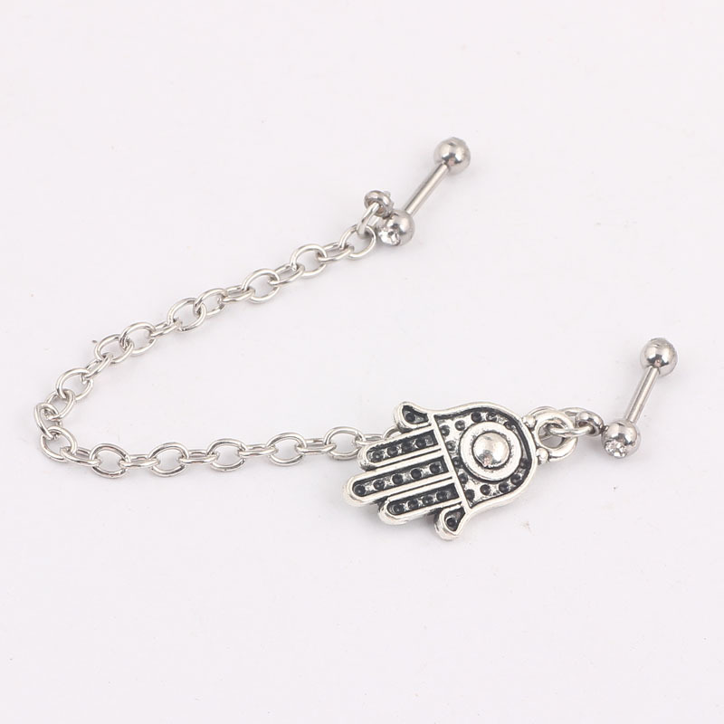 Silver pointed spike labret stud material detail
