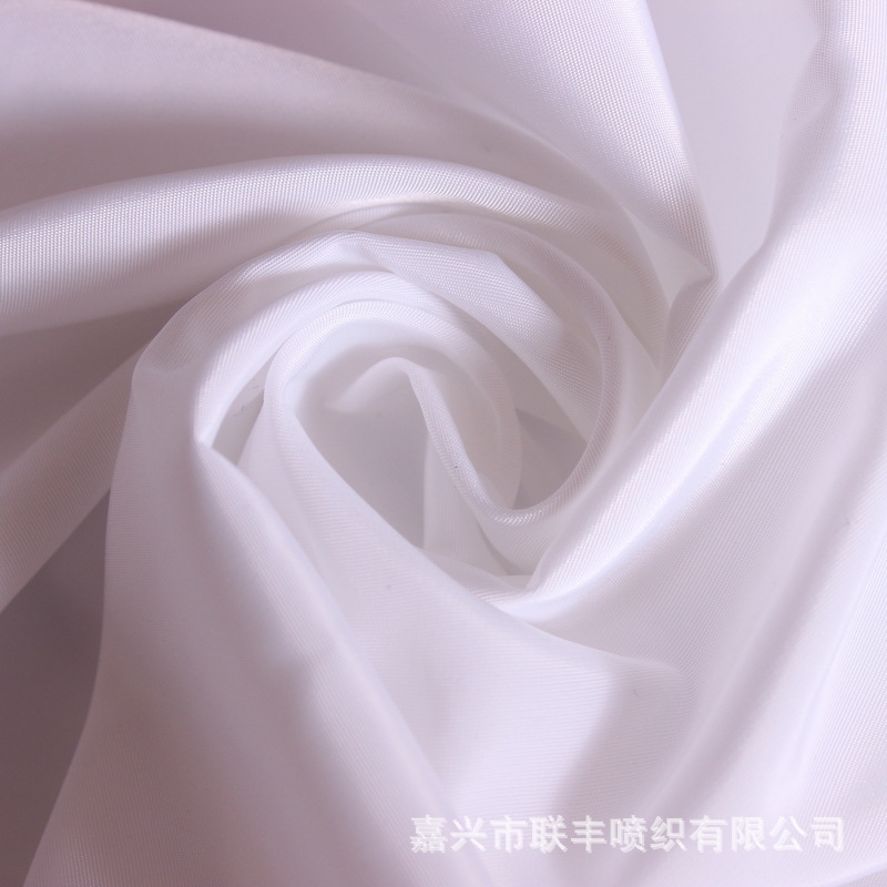 热销产品增白75D半弹加捻平纹花瑶  休闲服棉衣羽绒服女装面料