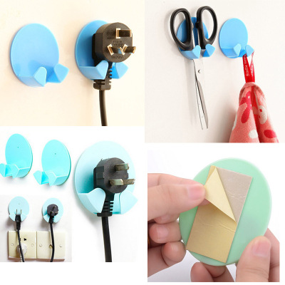 厂家创意  无痕粘贴式电源插头挂钩 椭圆型插座支架 可印logo