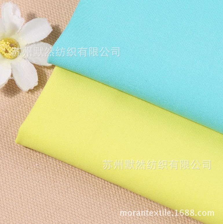 32S*100D/40D 2/2斜纹弹力棉涤 弹力风衣夹克棉服面料 厂家直销