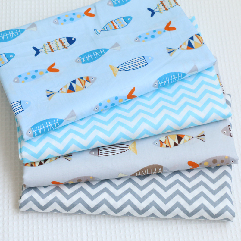 幼儿园儿童卡通纯棉梭织面料 小鱼波纹印花布 婴儿全棉斜纹布料