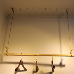 Vintage macrame clothing rack, wooden rod hanger, garment store hanger for displaying clothes on wire wall hanger