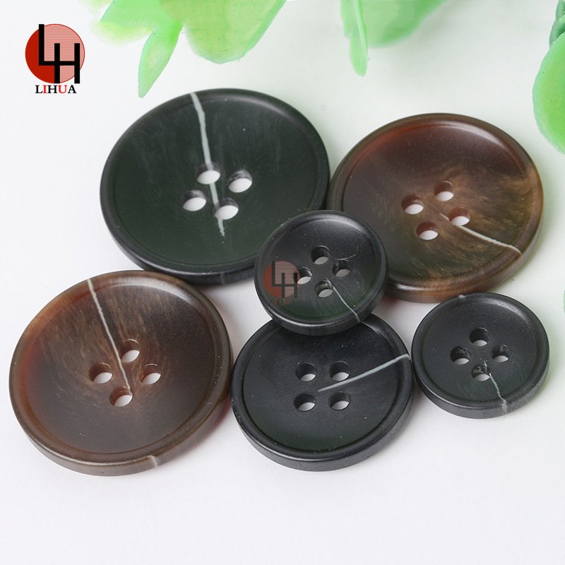 现货批发树脂细边扣子四眼仿牛角纽扣服装装饰钮扣大衣风衣纽扣