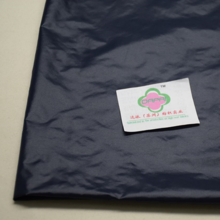 服装面料厂家400T超亮薄型涤塔夫亮面PU涂层羽绒服f防棉里料夹克