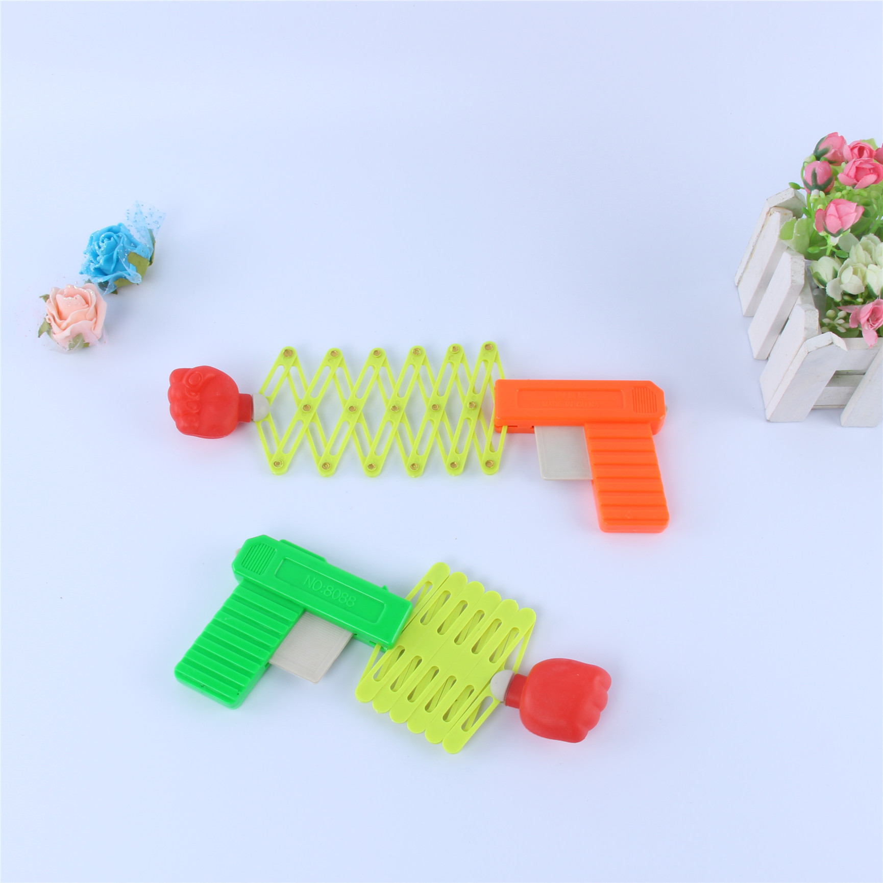 Lustige, streichartige, magische, elastische, einziehbare Faustpistole für Kinder, Tempelmesse, Kinderspielzeug_voghion.com