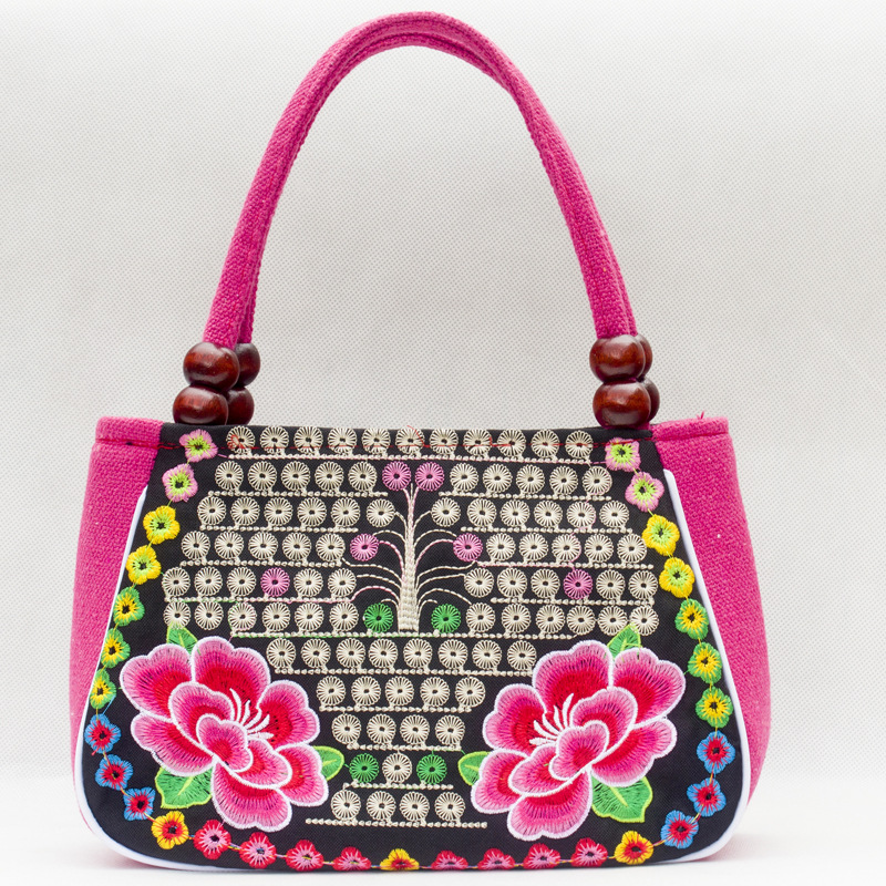 Directo de fábrica nuevo estilo étnico bordado bolsa cobre moneda flor pequeño bolso Yunnan bordado bolso especial Miao bordado bolsa