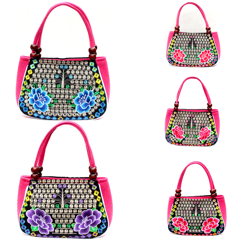 Directo de fábrica nuevo estilo étnico bordado bolsa cobre moneda flor pequeño bolso Yunnan bordado bolso especial Miao bordado bolsa