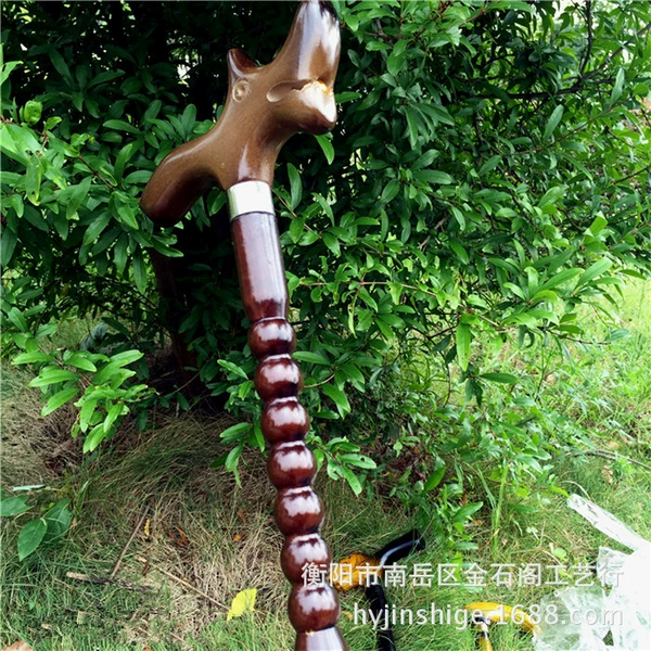 The brown gourd-shaped sandalwood crutch is about 94 cm long